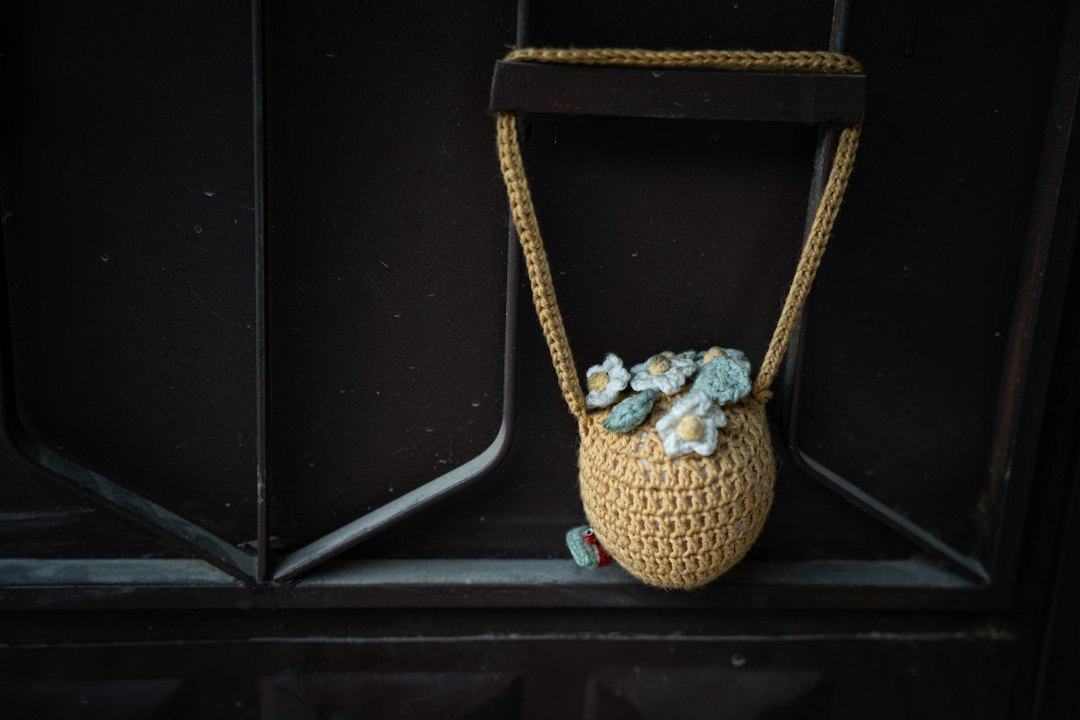 Small yellow crocheted bag used as a cheerful handmade accessory image